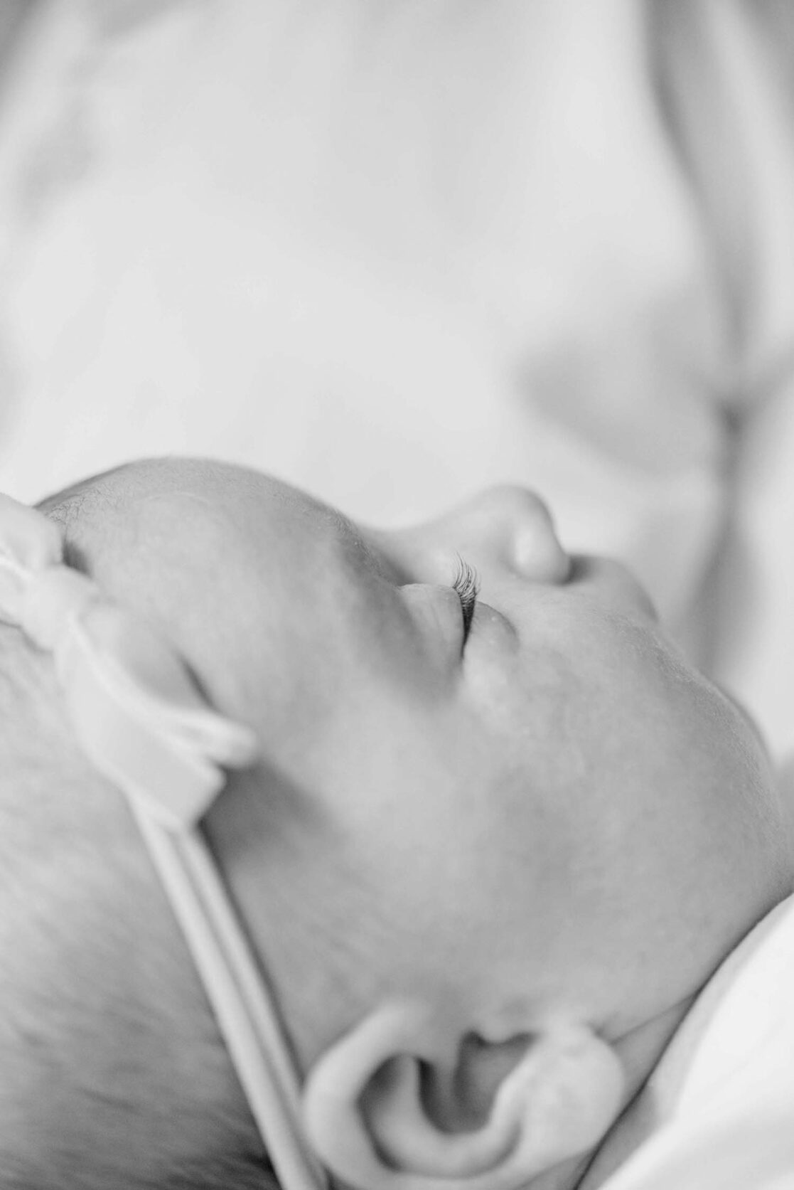 Black and white photo of two month old baby eyelashes 