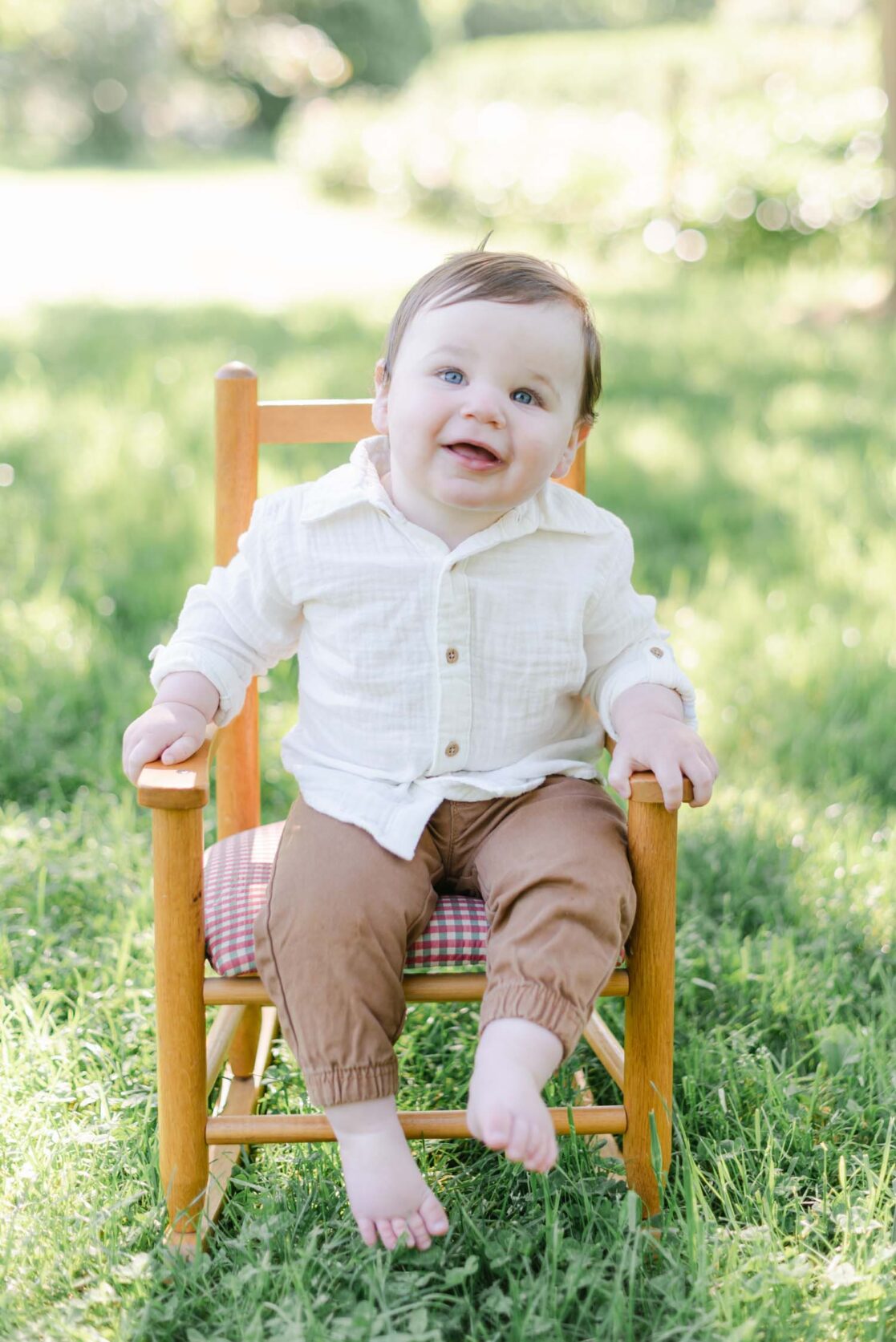 Photo of one year old baby boy in a rocking chair by Richmond baby photographer Jacqueline Aimee Portraits