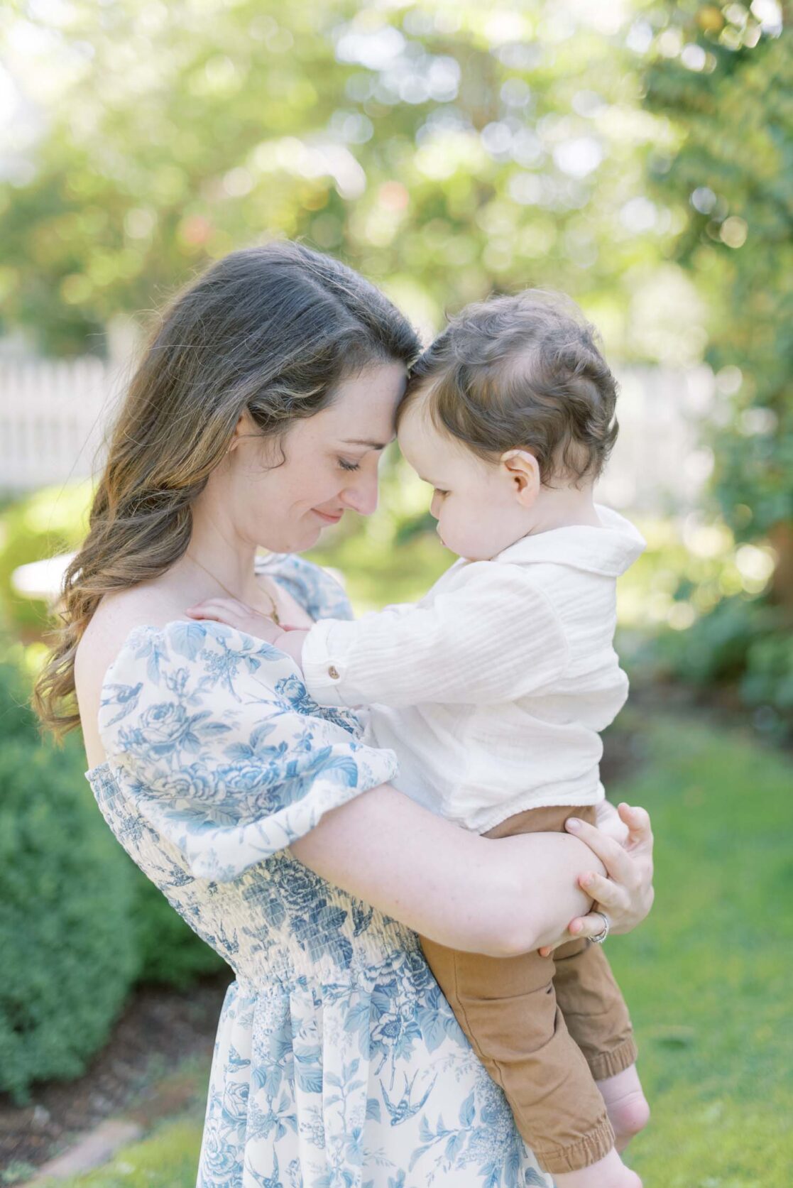 Photo of mom nuzzling one year old son up in their air by Richmond baby photographer Jacqueline Aimee Portraits