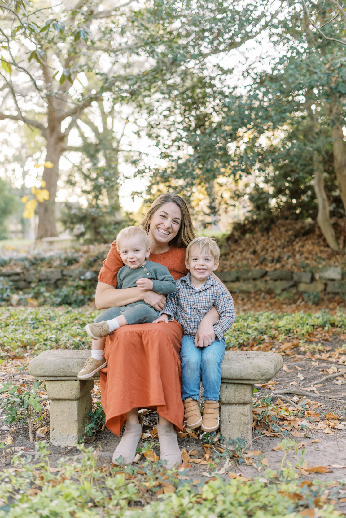mother posed with 2 sons for family portrait