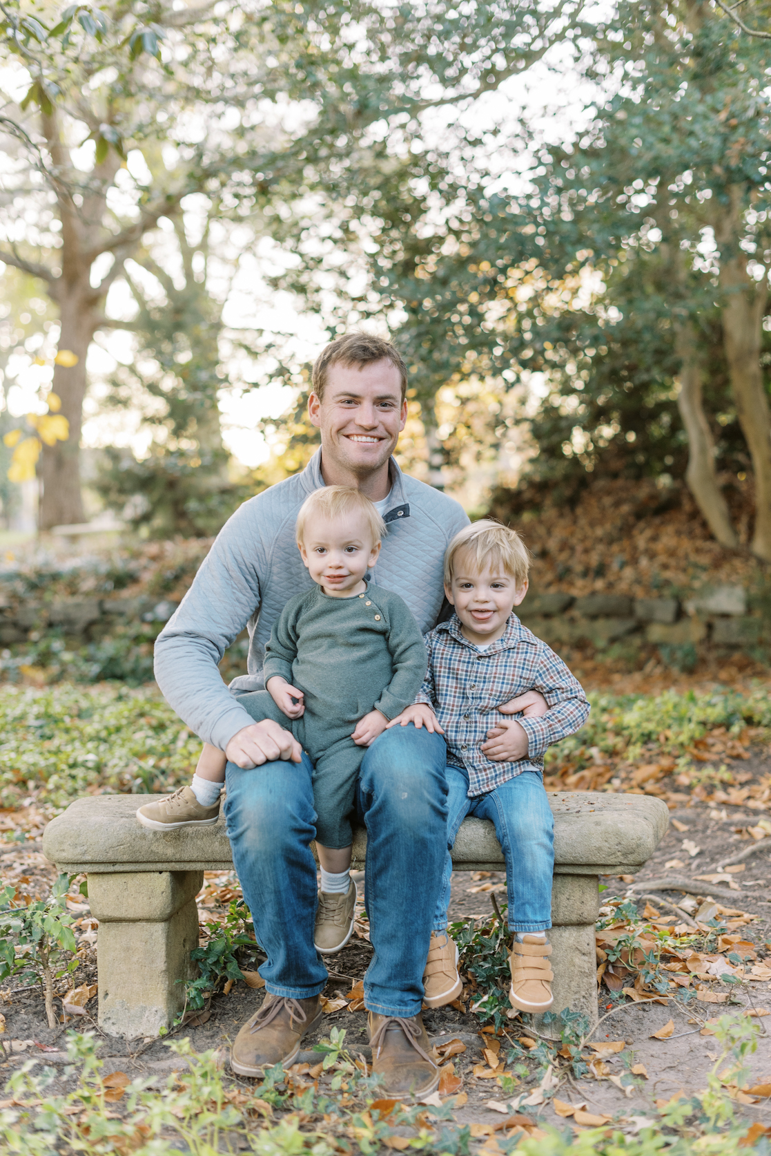 father posed with 2 sons for family portrait