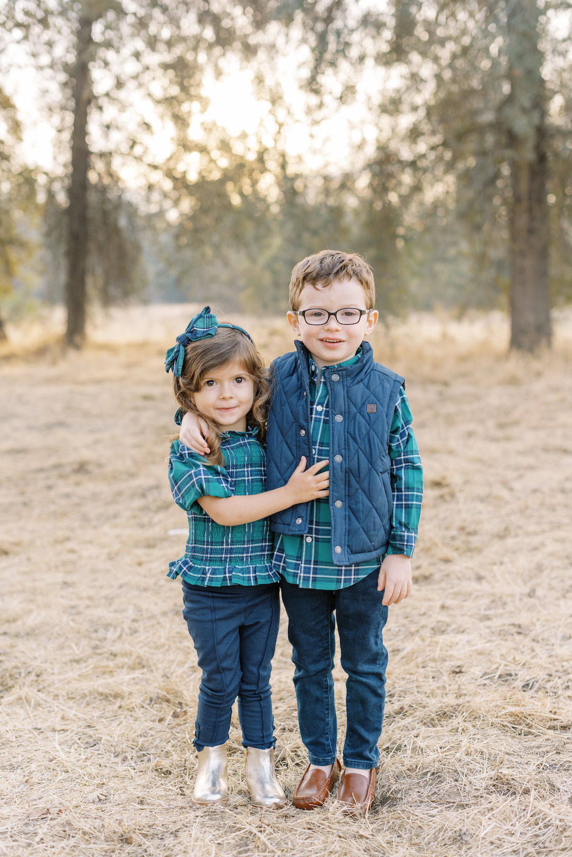brother and sister posed together for holiday portraits