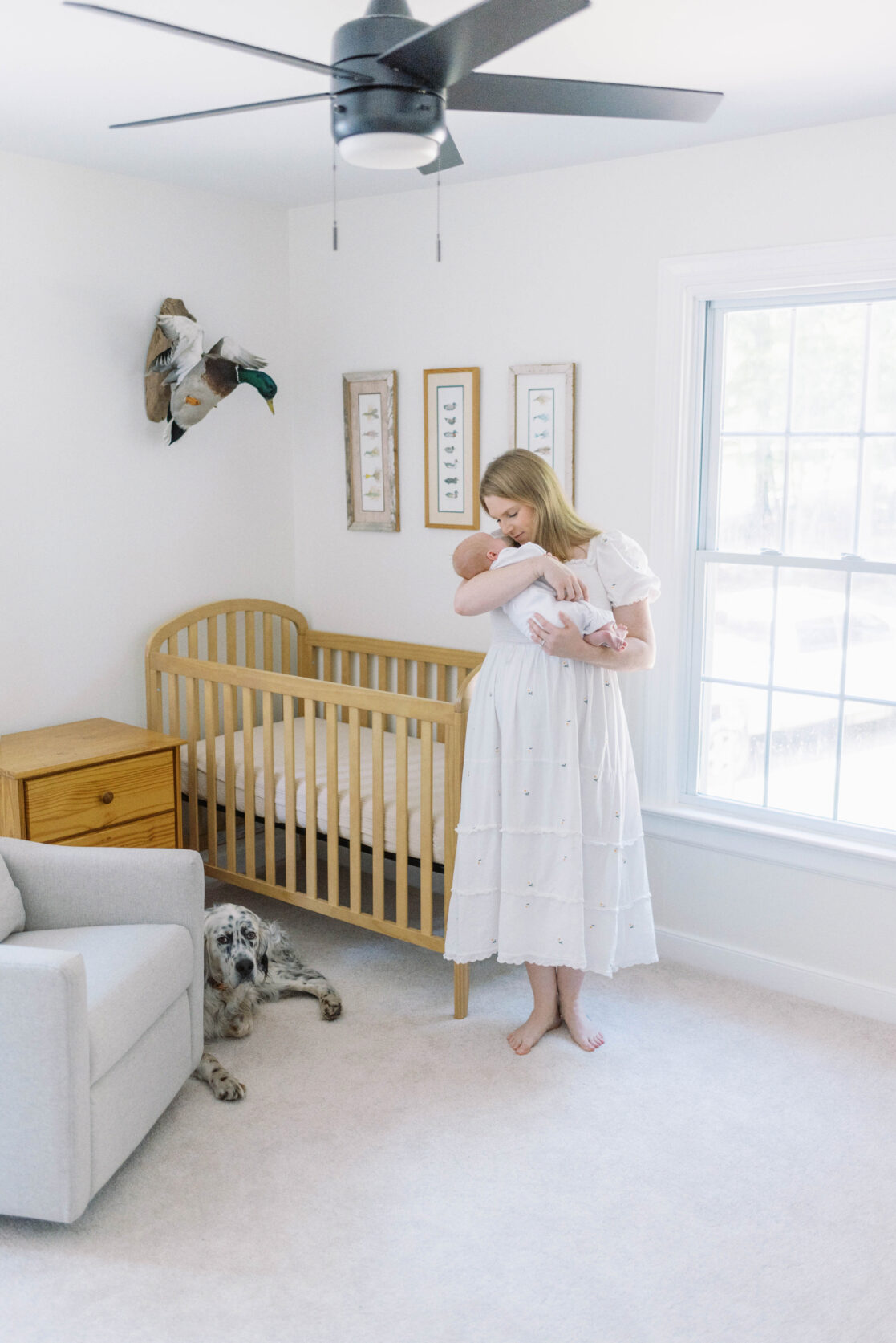 Key poses for newborn photos | Light and airy photo of a mother snuggling her sleeping newborn baby in her arms by Richmond newborn photographer Jacqueline Aimee Portraits