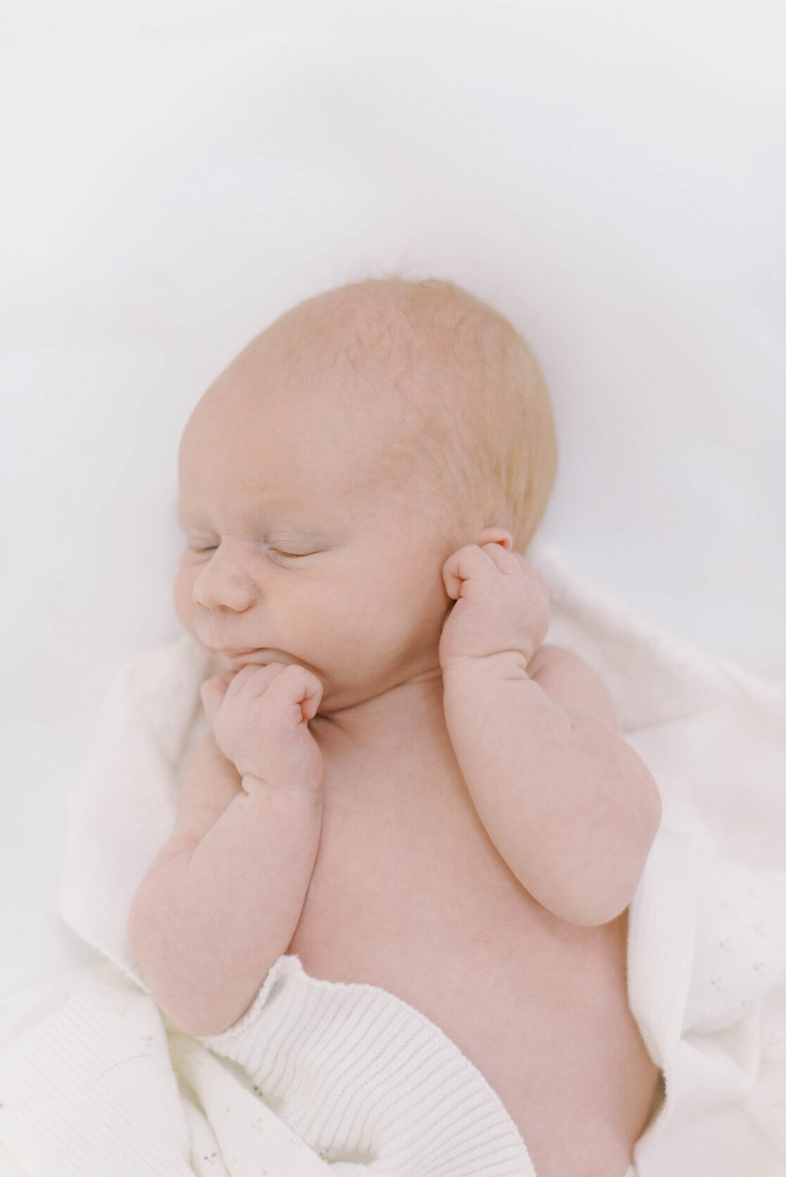 Key poses for newborn photos | Light airy close up photo of a sleeping newborn baby boy's face by Richmond newborn photographer Jacqueline Aimee Portraits