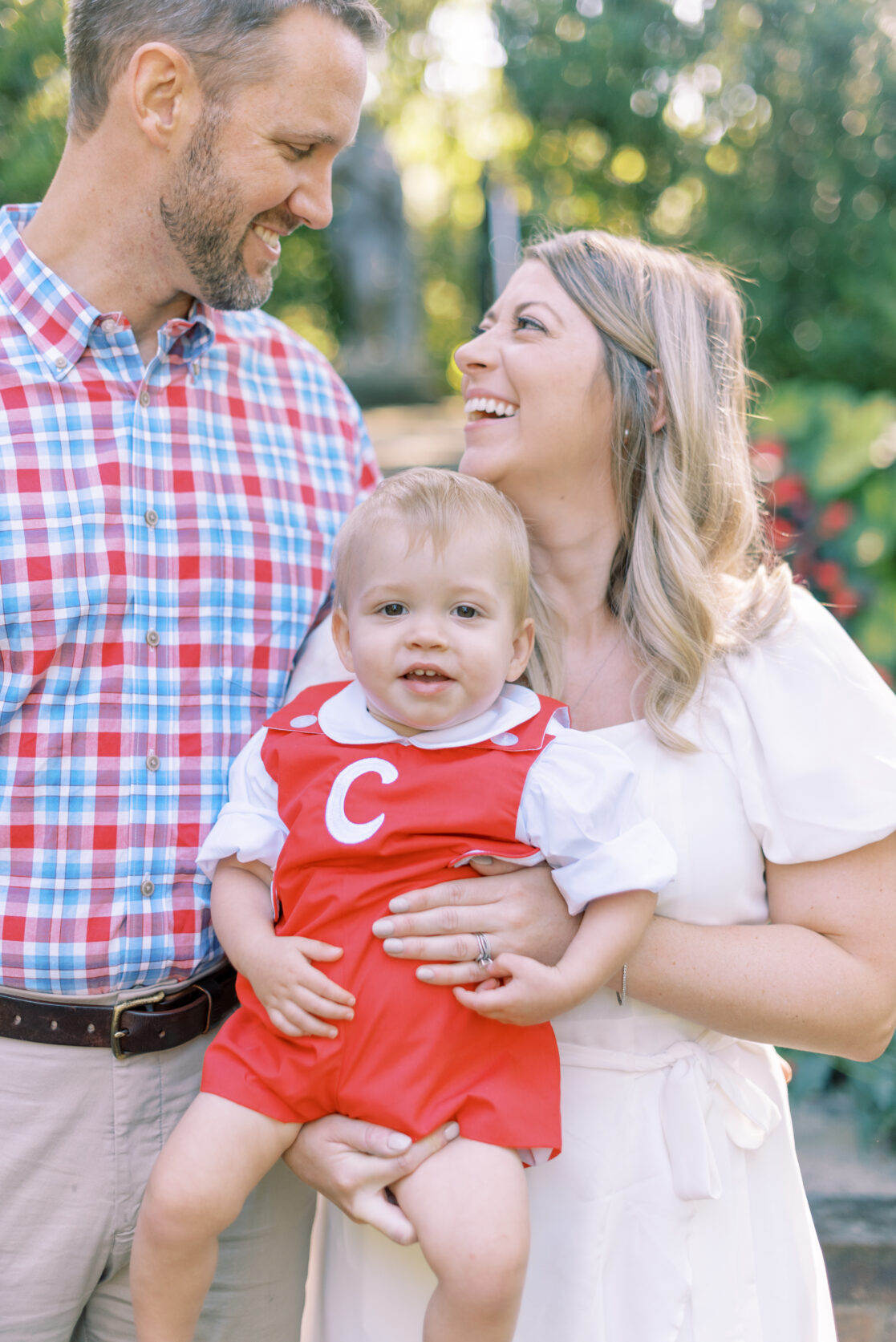 Photo of a family of three laughing during their richmond fall mini session with jacqueline aimee portraits