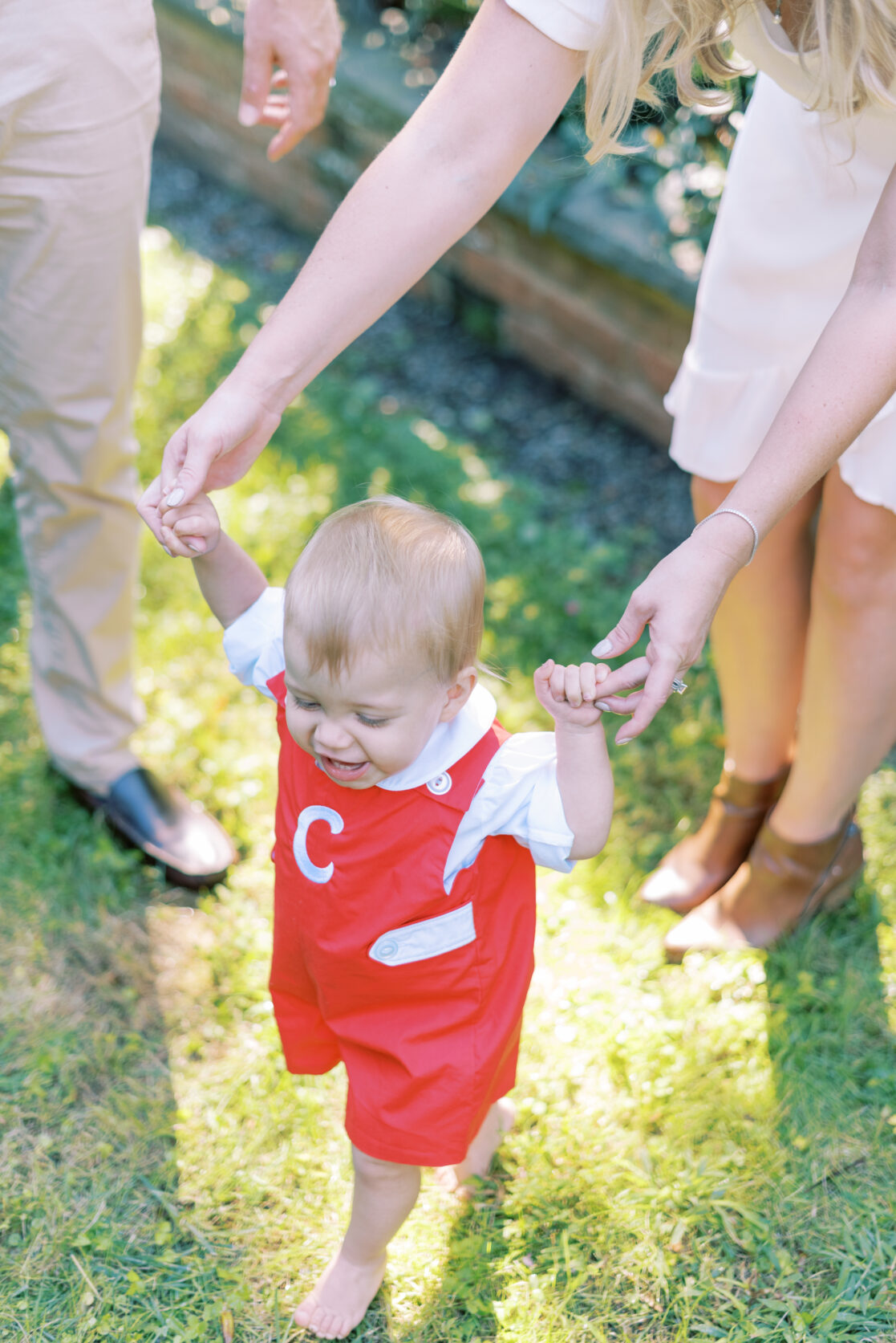 Photo of a toddler practicing his walking during their richmond fall mini session with jacqueline aimee portraits