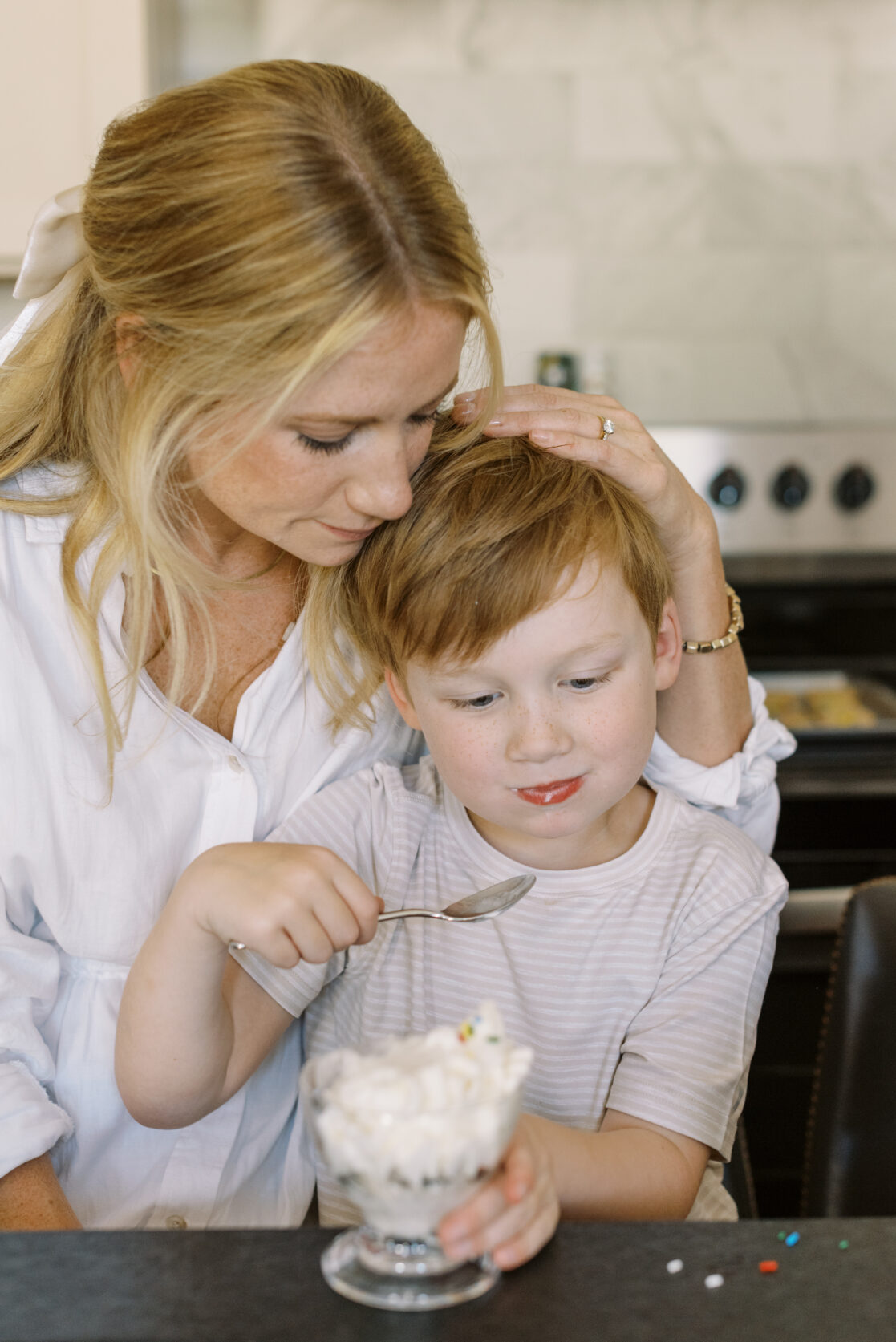 Mom and son snuggling while enjoying ice cream during tips for fun family photos in Richmond by Jacqueline Aimee Portraits 