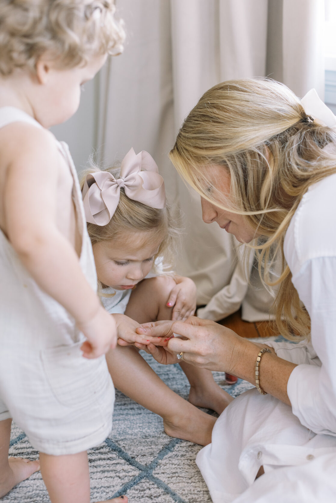 Mom painting her daughter's nails during fun family photos in Richmond by Jacqueline Aimee Portraits 