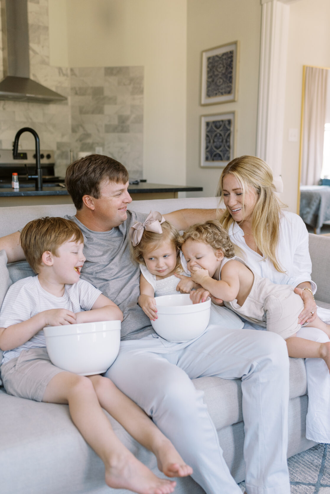 Family enjoying popcorn and a movie during fun family photos in Richmond by Jacqueline Aimee Portraits 