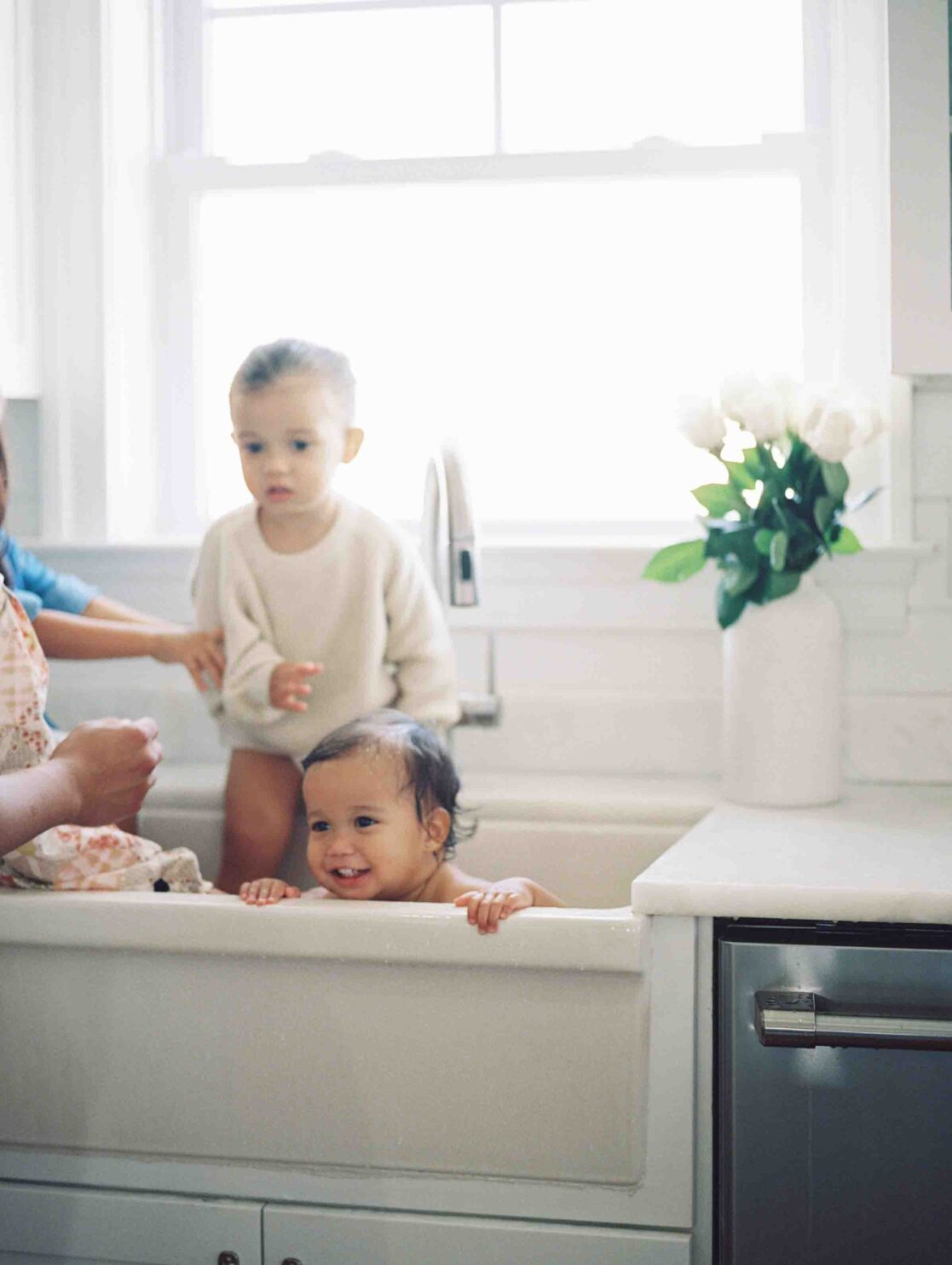 Expert pediatricians in Richmond | Film Photo of a baby girl taking a bath in the sink by Richmond newborn photographer Jacqueline Aimee Portraits